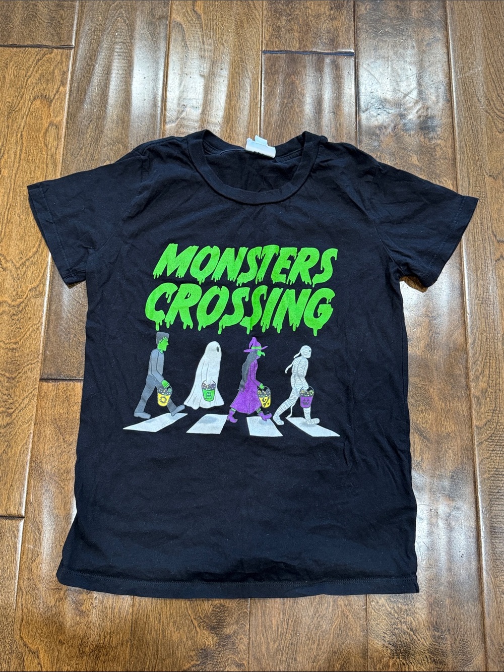 LuLaRoe Black 'Monsters Crossing' Graphic Tee with Neon Green Lettering